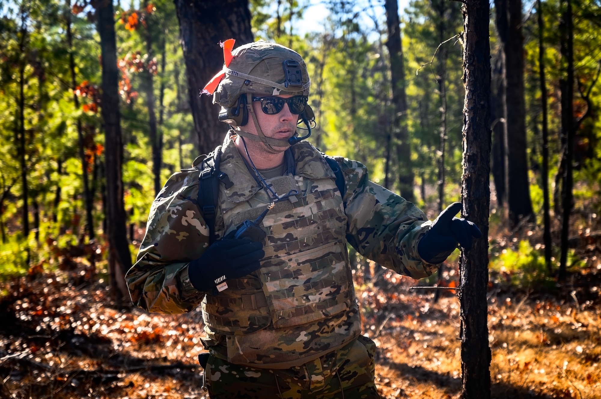 U.S. Army Sgt. 1st Class Ryan Lansing, 1-102nd Infantry Regiment infantryman, relays radio communications during a live-fire exercise at Joint Base McGuire-Dix-Lakehurst, N.J., Feb. 1, 2025. The platoon live-fire exercise incorporated land navigation through indirect fire and utilized unmanned aerial vehicle systems for both reconnaissance and offensive maneuvers. (U.S. Air Force photo by Senior Airman Matt Porter)
