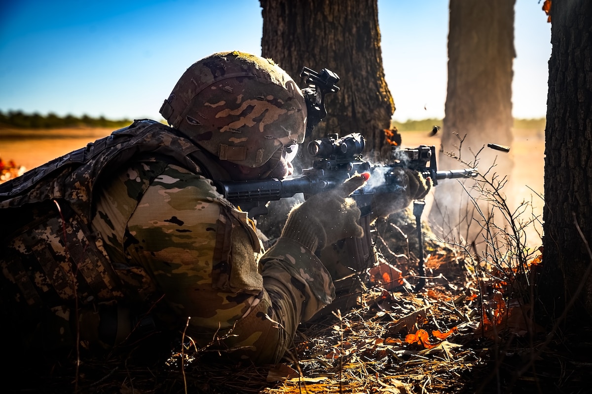 U.S. Army Sgt. Kyrie Johnson, 1-102nd Infantry Regiment infantryman, provides suppressive fire during a platoon live-fire exercise at Joint Base McGuire-Dix-Lakehurst, N.J., Feb. 1, 2025. The platoon live-fire exercise incorporated land navigation through indirect fire and utilized unmanned aerial vehicle systems for both reconnaissance and offensive maneuvers. (U.S. Air Force photo by Senior Airman Matt Porter)