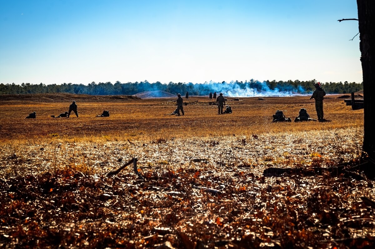 U.S. Army Soldiers assigned to the 1-102nd Infantry Regiment engage an opposing team during a platoon live-fire exercise at Joint Base McGuire-Dix-Lakehurst, N.J., Feb. 1, 2025. The platoon live-fire exercise incorporated land navigation through indirect fire and utilized unmanned aerial vehicle systems for both reconnaissance and offensive maneuvers. (U.S. Air Force photo by Senior Airman Matt Porter)