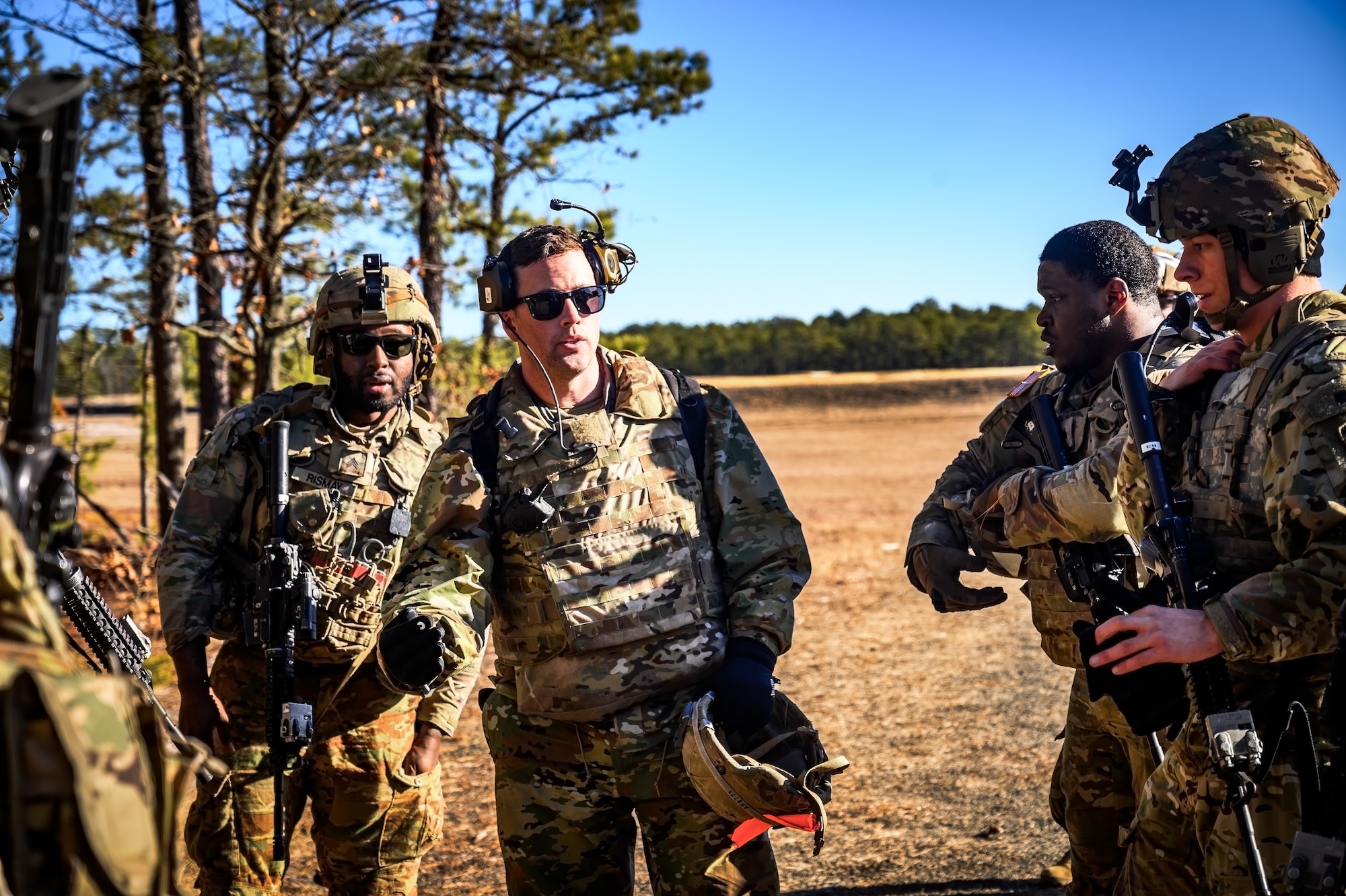 U.S. Army Soldiers assigned to the 1-102nd Infantry Regiment hold an after action brief following a platoon live-fire exercise at Joint Base McGuire-Dix-Lakehurst, N.J., Feb. 1, 2025. The platoon live-fire exercise incorporated land navigation through indirect fire and utilized unmanned aerial vehicle systems for both reconnaissance and offensive maneuvers. (U.S. Air Force photo by Senior Airman Matt Porter)
