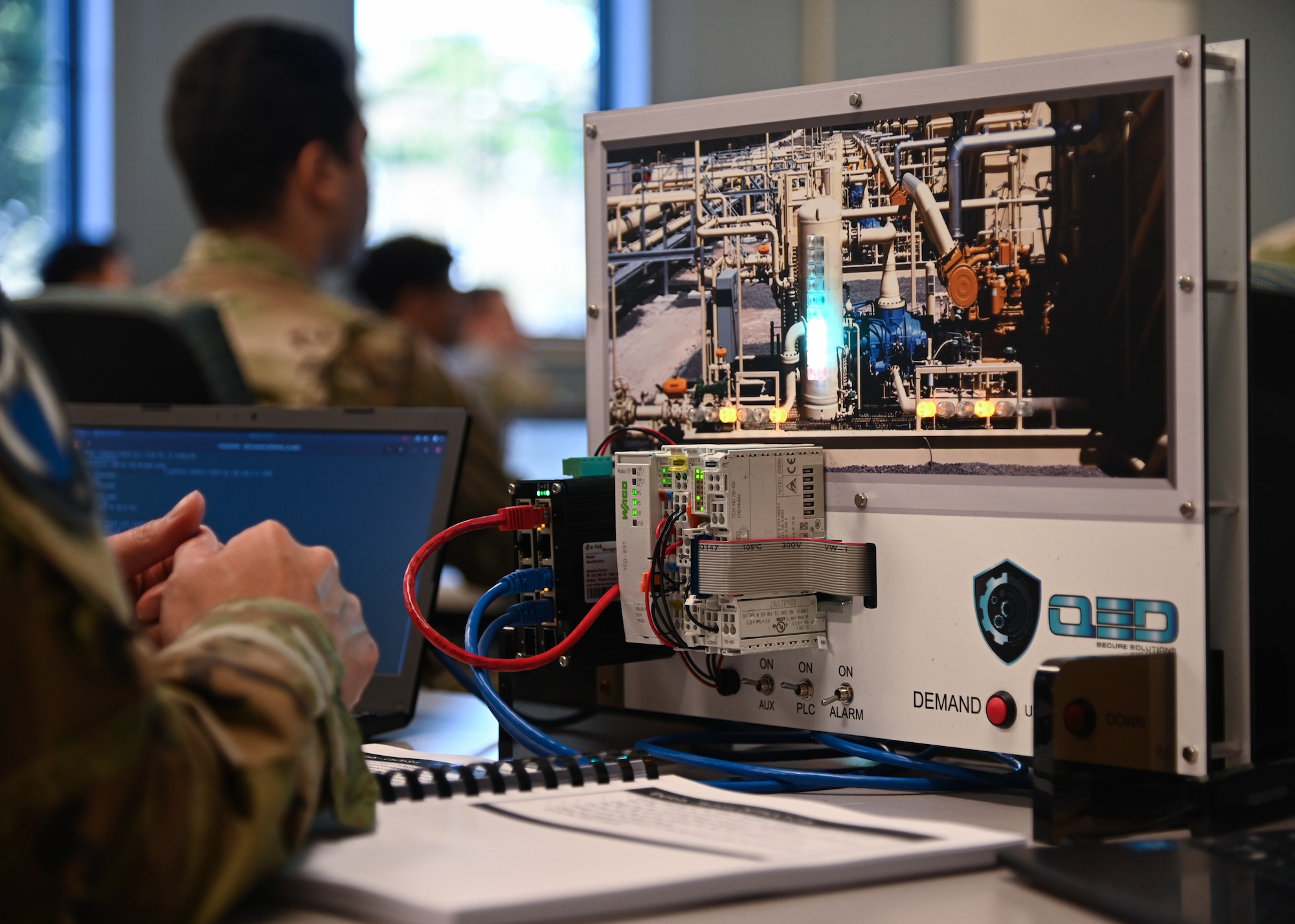 military students use classroom simulators to practice cybersecurity attacks and defenses in a classroom