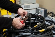 Brian Moebs, Air Force Repair Enhancement Program (AFREP) technician, repairs an engine cable at Beale Air Force Base, California, Jan. 27, 2025.