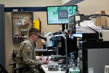 U.S. Air Force Staff Sgt. Shawn Powers, 9th Maintenance Air Force Repair Enhancement Program (AFREP) technician, repairs a multilayer circuit card at Beale Air Force Base, California, Feb. 4, 2025.