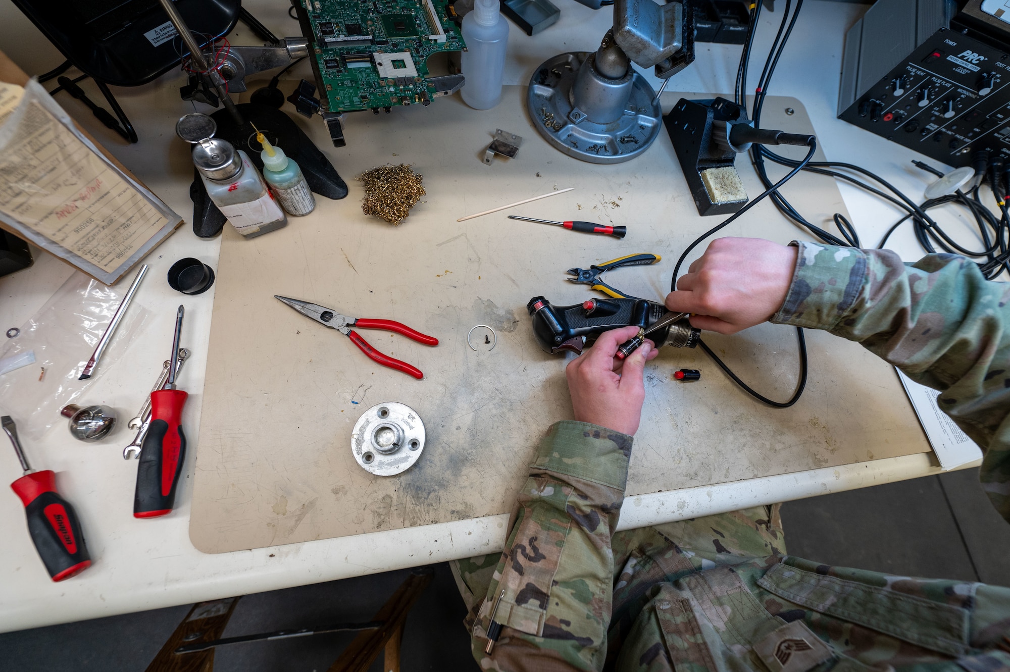 U.S. Air Force Staff Sgt. Shawn Powers, 9th Maintenance Air Force Repair Enhancement Program (AFREP) technician, repairs a T-38 Talon stick grip at Beale Air Force Base, California, Feb. 4, 2025.