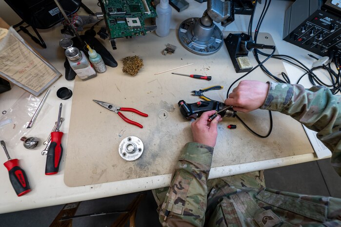 U.S. Air Force Staff Sgt. Shawn Powers, 9th Maintenance Air Force Repair Enhancement Program (AFREP) technician, repairs a T-38 Talon stick grip at Beale Air Force Base, California, Feb. 4, 2025.