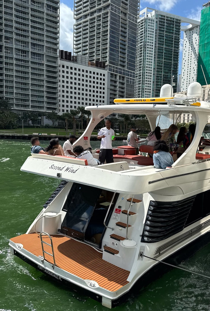 Coast Guard Sector Miami law enforcement officers, along with federal and state law enforcement partners, board the 52-foot cabin cruiser Second Wind in Miami, Feb. 22, 2025. The owner of the Second Wind was reportedly operating the vessel as an illegal charter, with 13 passengers for hire on the vessel, violating a previously issued Captain of the Port Order from January 2023 for conducting other passenger for hire operations. (U.S. Coast Guard photo)