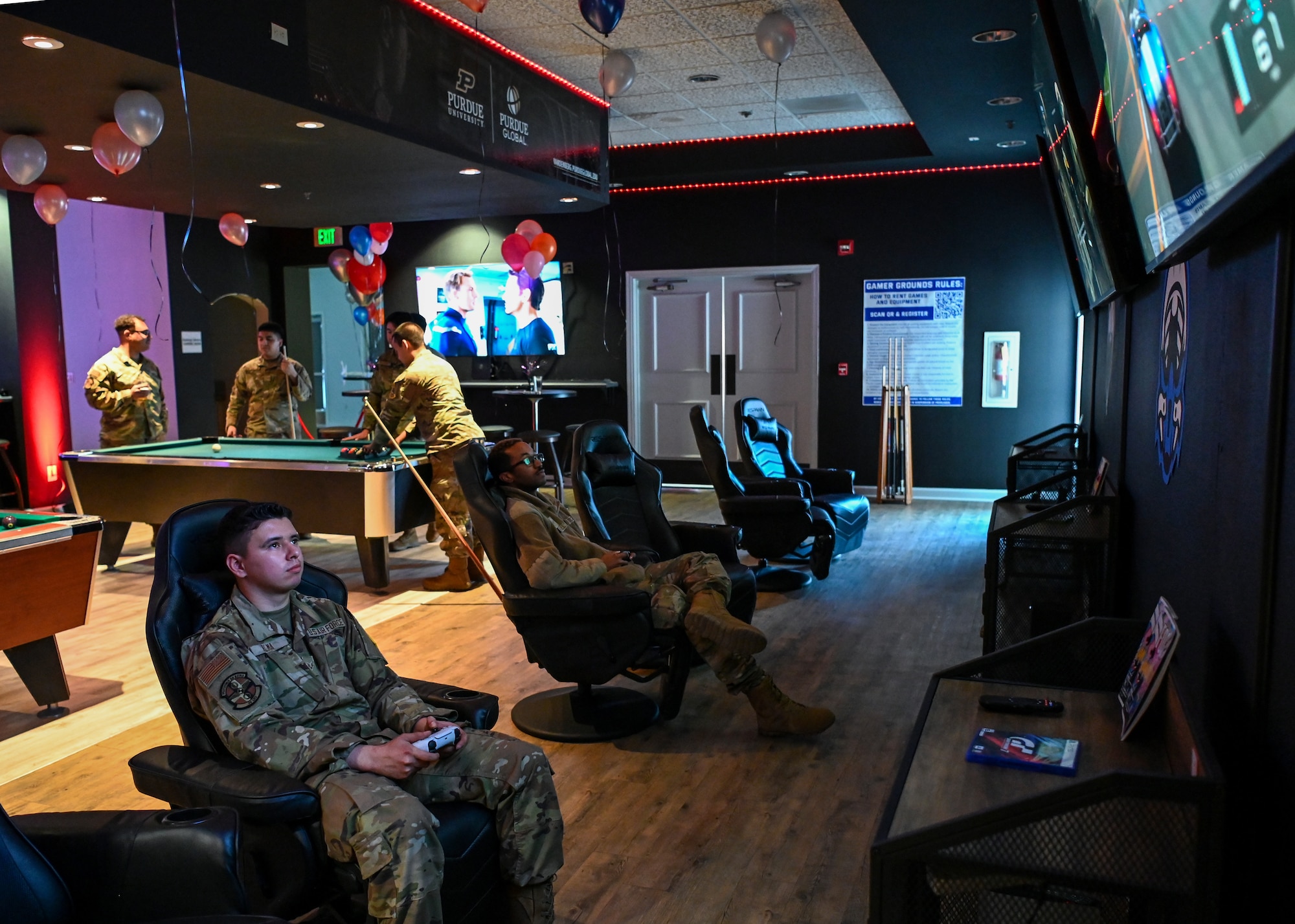 Airmen enjoy the new amenities during the Pacific Coast Center gaming room grand opening at Vandenberg Space Force Base.