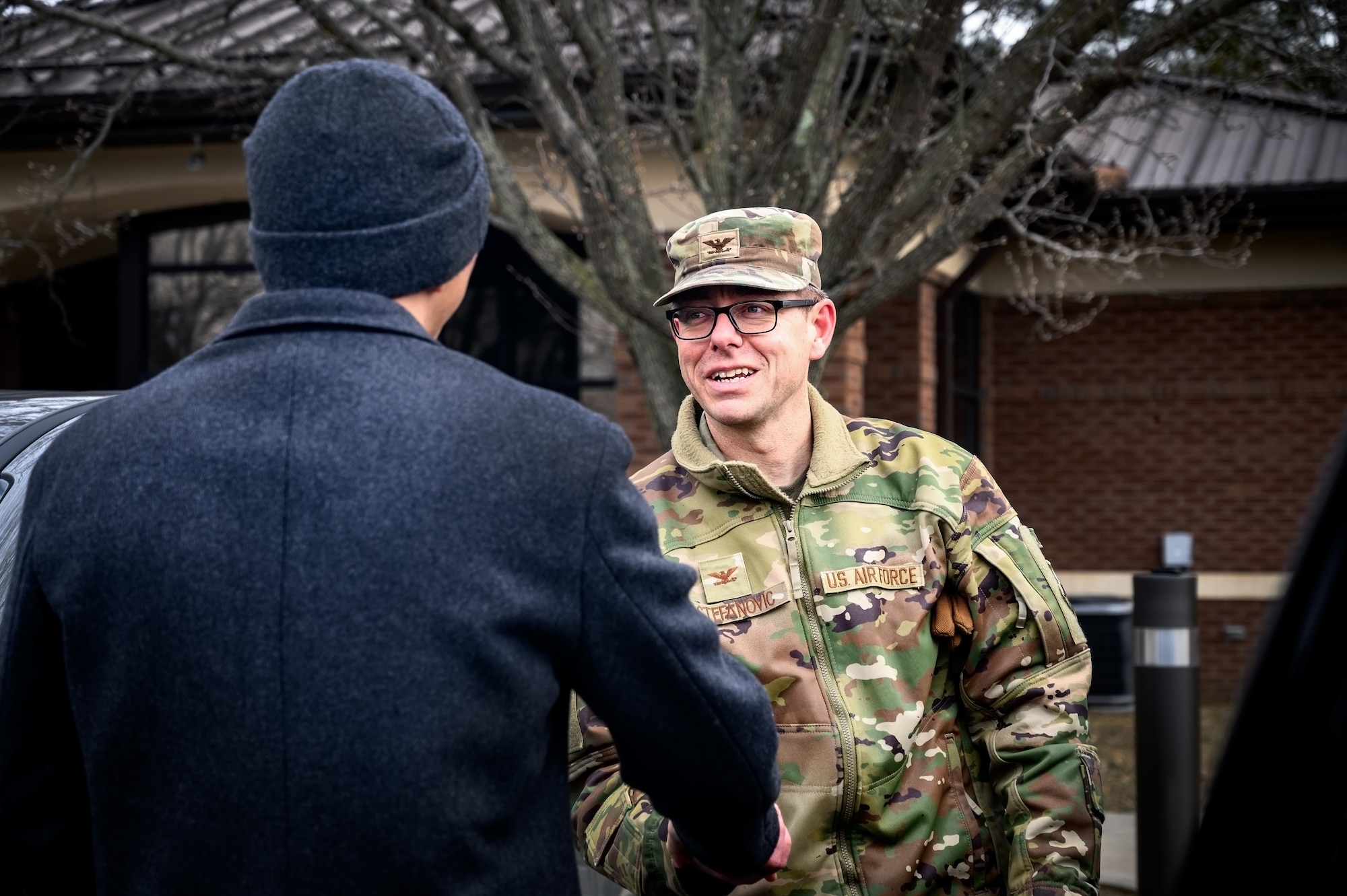 U.S. Air Force Col. Michael Stefanovic (right), 87th Civil Engineer Group commander, greets Maj. Gen. Kelvin Fan (left), Republic of Singapore Air Force chief of staff, at Joint Base McGuire-Dix-Lakehurst, N.J., Feb. 20, 2025. The RSAF visit showcased JB MDL’s power sources such as backup generators, batteries, and a photovoltaic power station intended to improve grid resiliency and support day-to-day operations among its 89 mission partners. (U.S. Air Force photo by Senior Airman Matt Porter)