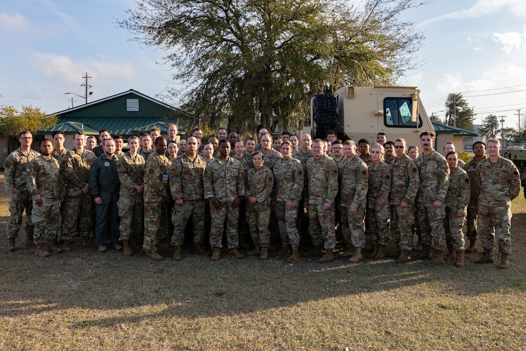 A group of Airmen stand for a photo