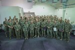 U.S. Naval Reserve Sailors attached to U.S. Naval Forces Central Command and U.S. 5th Fleet pose for group photo during International Maritime Exercise (IMX) 2025.
