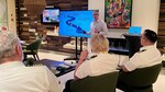 Joint Maritime Information Center director, U.S. Navy Capt. Lee Stuart, briefs cruise line personnel on the maritime security situation in the Middle East region during a visit to a cruise ship visiting Bahrain.