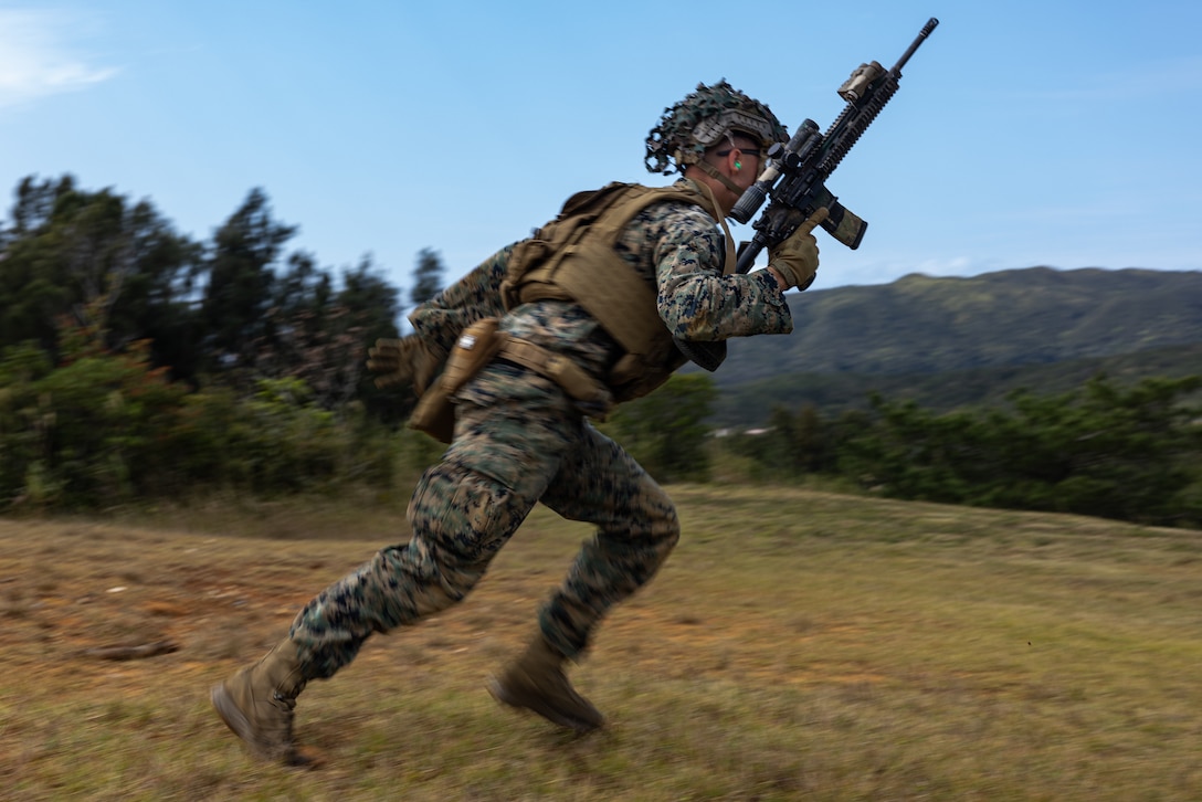 A U.S. Marine with 3d Marine Division bounds during a live-fire range on Camp Hansen, Okinawa, Japan, Feb. 14, 2025. The four-day field exercise focused on marksmanship skills and fire team fire and movement, strengthening the unit’s combat capabilities. Live-fire ranges give Marines the opportunity to engage and destroy targets in a dynamic environment, enhancing battlefield effectiveness. (U.S. Marine Corps photo by Lance Cpl. Rodney Frye)