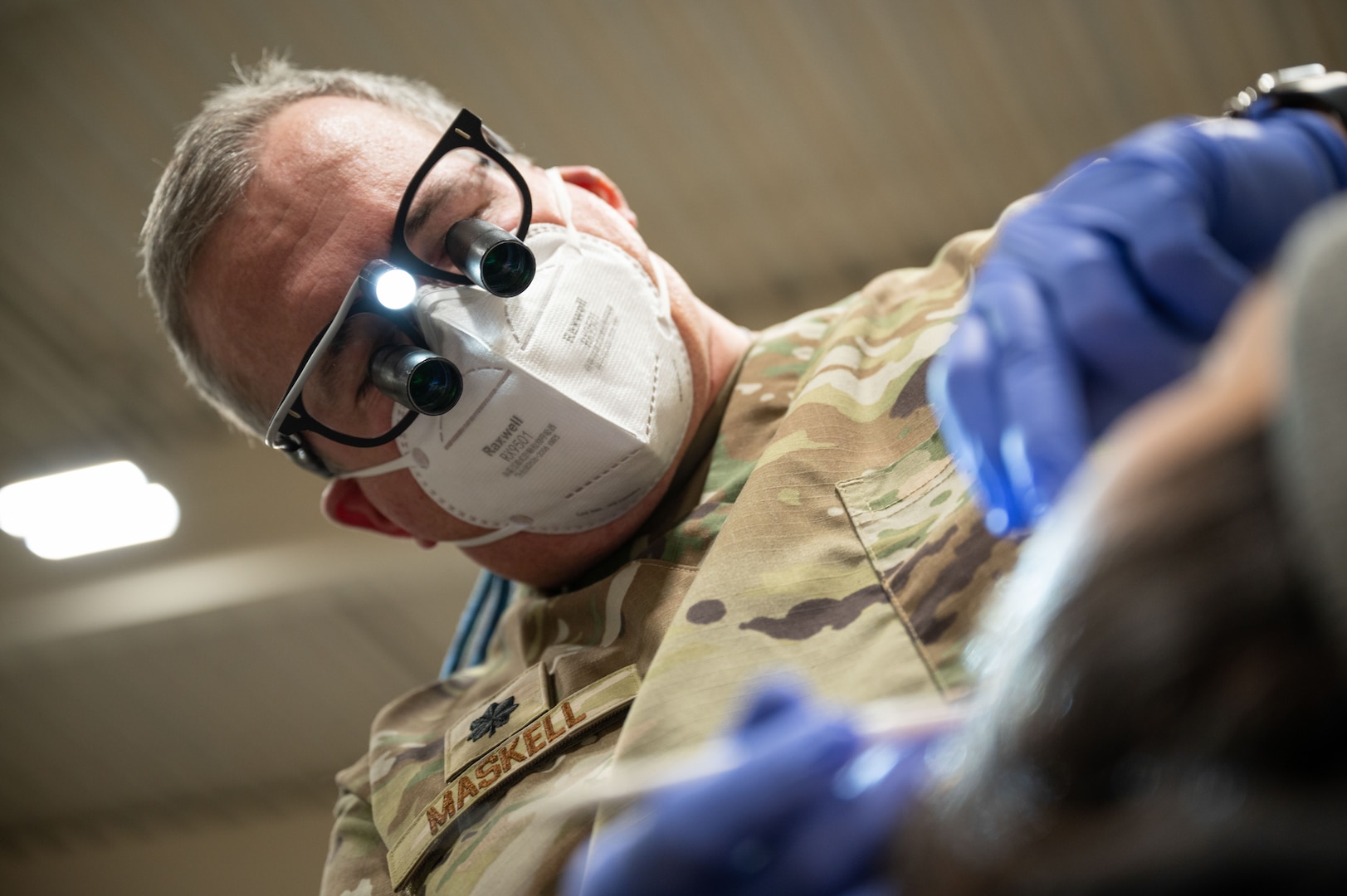 U.S. Air National Guard Lt. Col. Kevin Maskell, a dentist assigned to the Arizona Air National Guard 162nd Wing, examines a patient during Kodiac Arctic Care 24 in Kodiak, Alaska, May 9, 2024. U.S. Uniformed Services personnel joined Kodiak Arctic Care under the Innovative Readiness Training program, which partnered with the Kodiak Area Native Association to deliver free medical, dental optometry, and veterinary services on Alaska's remote Kodiak Island.