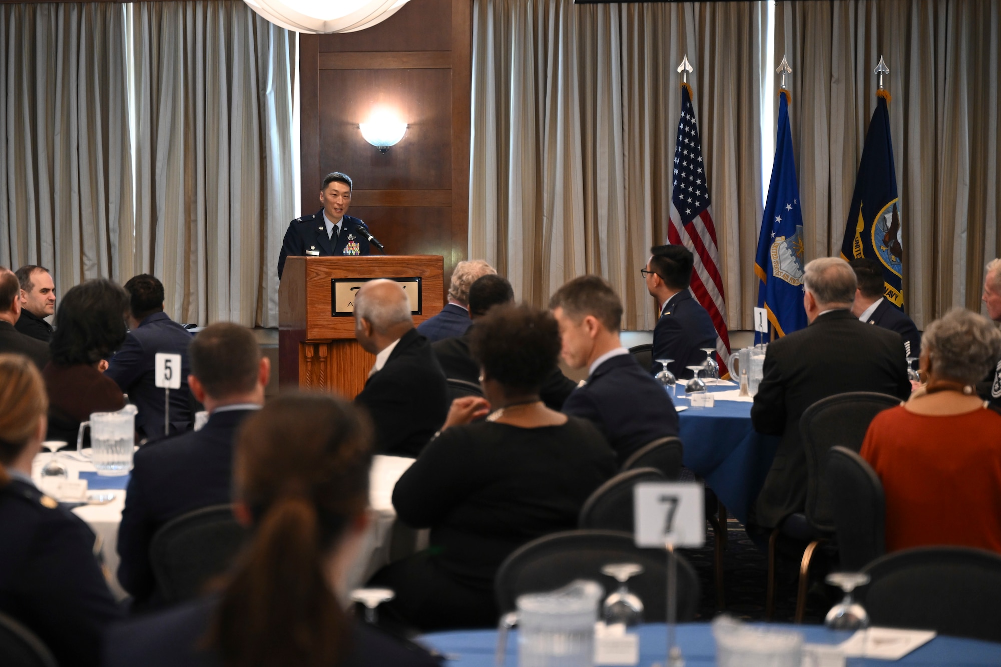 U.S. Air Force Col. Jun S. Oh, 316th Wing and installation commander, delivers remarks during the Honorary Commander Ceremony at Joint Base Andrews, Md., Feb. 20, 2025. Oh emphasized the importance of collaboration between the military and the community to enhance mutual understanding and support. (U.S. Air Force photo by Senior Airman Gianluca Ciccopiedi)