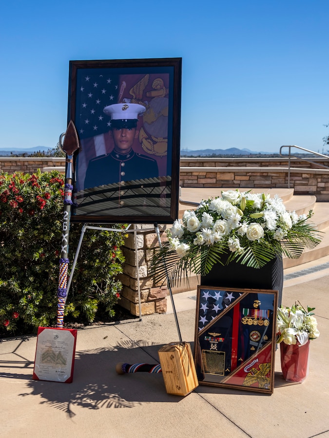 U.S. Marines with I Marine Expeditionary Force Information Group bring gifts to mourn the passing of Sgt. Jacob M. Durham, an electronic intelligence/electromagnetic warfare analyst who was assigned to 1st Radio Battalion, I MIG on Feb. 22, 2025. Durham, a native of Long Beach, California, passed away in an aircraft incident during a routine mission in support of U.S.-Philippine security cooperation activities, Feb. 6, 2025. The aircraft was providing intelligence, surveillance, and reconnaissance support at the request of Philippine allies. (U.S. Marine Corps photo by Sgt. Amelia Kang)