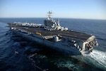 An aircraft carrier on the ocean.