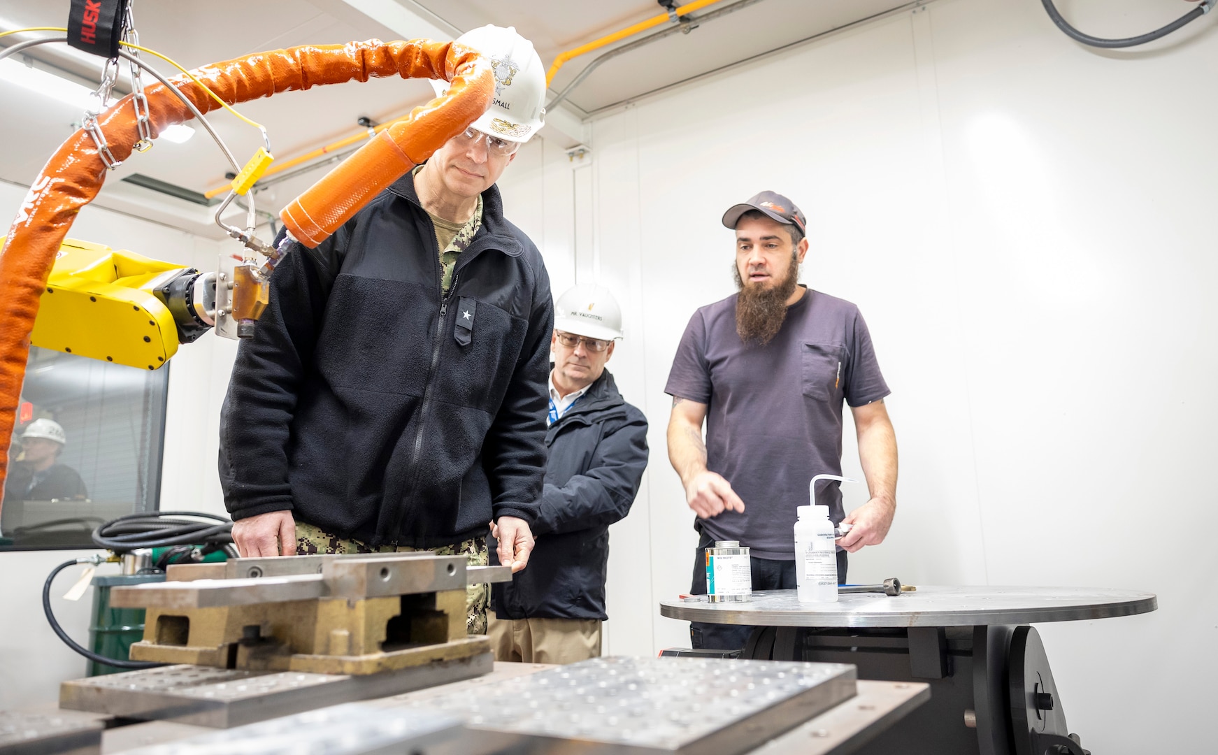 Rear Adm. Peter Small, chief engineer & deputy commander, Naval Sea Systems Engineering & Logistics tours Shop 31, at Puget Sound Naval Shipyard & Intermediate Maintenance Facility in Bremerton, Washington Feb. 4, 2025. (U.S. Navy photo by Wendy Hallmark)