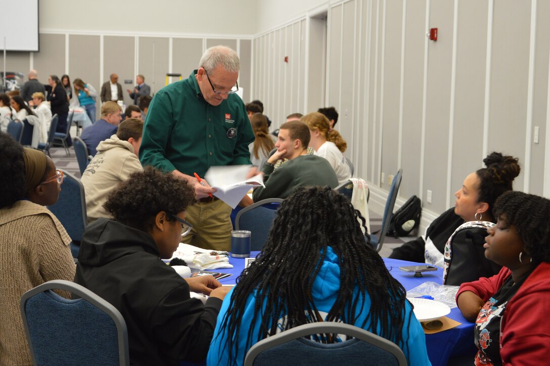 U.S. Army Corps of Engineers, Jacksonville District Engineer William Wigner helping students participating in Engineering Career Day, an event hosted in partnership with The Society of American Military Engineers (SAME) Jacksonville Post at the Downtown Jacksonville Main Library.
