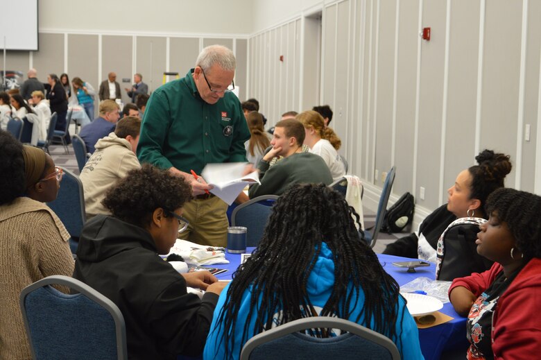 U.S. Army Corps of Engineers, Jacksonville District Engineer William Wigner helping students participating in Engineering Career Day, an event hosted in partnership with The Society of American Military Engineers (SAME) Jacksonville Post at the Downtown Jacksonville Main Library.