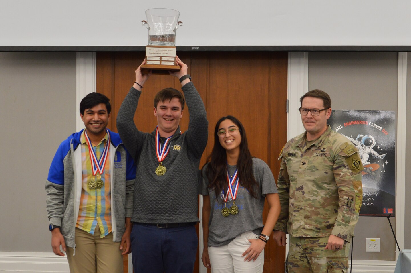 U.S. Army Corps of Engineers, Jacksonville District Commander, Col. Brandon Bowman, together with the overall winners of the Engineering Career Day event from Bolles High School. The event was hosted in partnership with The Society of American Military Engineers (SAME) Jacksonville Post at the Downtown Jacksonville Main Library.