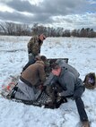 Russ Lawrence (standing) and Brody Rigby (front right) from Hill's Natural Resources Program work with members of the U.S. Fish and Wildlife Services and the Utah Division of Wildlife Services in collaring a deer south of the the base to assist in tracking movement and testing deer in the area for disease. The base's Environmental Branch, including the NRP, won two 2024 Air Force Civil Engineer Awards. (Courtesy photo)