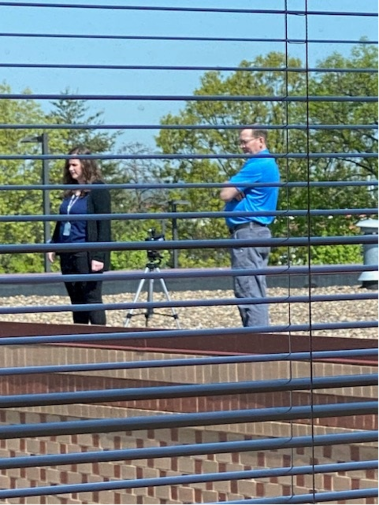 Employees on the Roof Taking Photos of an Event