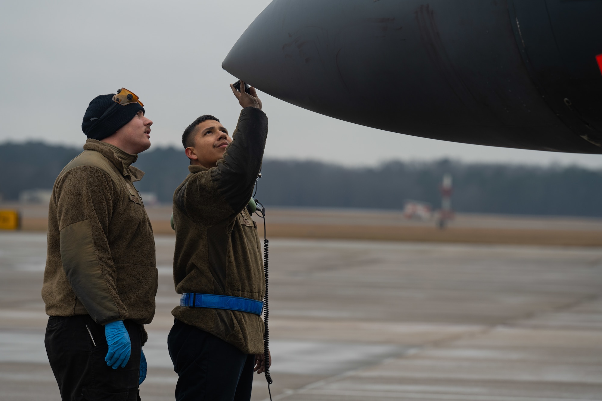 U.S. Air Force Senior Airman Juan Machado, right, and Airman Kyler Krutcher, assistant dedicated crew chiefs assigned to the 334th Fighter Generation Squadron, inspect an F-15E Strike Eagle before takeoff at Seymour Johnson Air Force Base, North Carolina, Jan. 27, 2025. The purpose of a pre-flight inspection is to ensure that the jets are properly maintained and safe for aircrew to fly. (U.S. Air Force photo by Airman 1st Class Rebecca Tierney)
