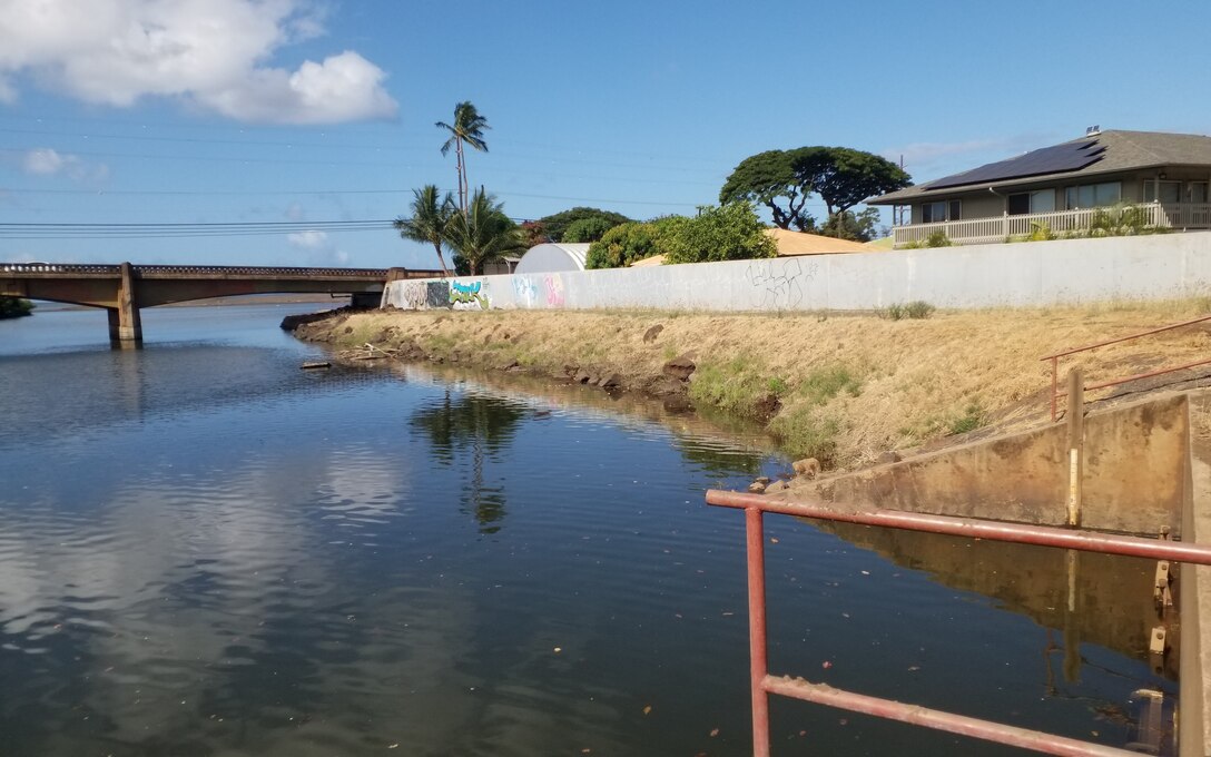 Waimea River Flood Control Project Flood Gates. Photo taken from right bank at flood gates facing downstream at Kaumuali'i Highway Bridge over Waimea River. (USACE, 2024)