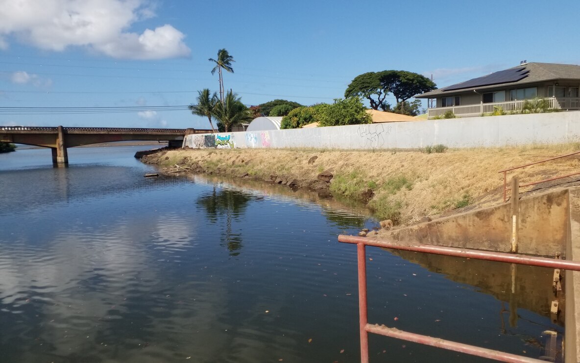 Waimea River Flood Control Project Flood Gates. Photo taken from right bank at flood gates facing downstream at Kaumuali'i Highway Bridge over Waimea River. (USACE, 2024)
