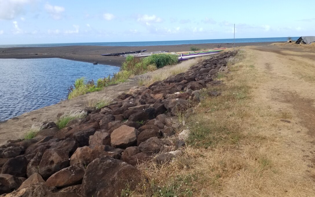 Terminus of Waimea River Flood Control Project levee. Photo taken from right bank, facing downstream at Waimea River stream mouth and Pacific Ocean. (USACE, 2024)