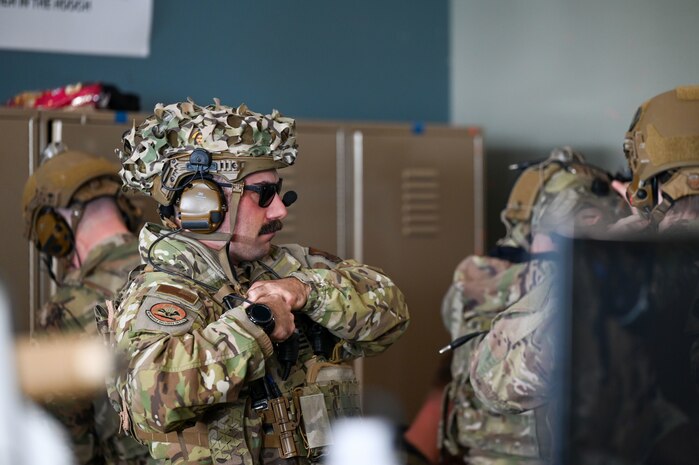 A tactical response force Airman gears up.