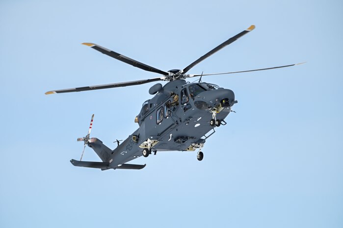 An MH-139A Grey Wolf helicopter is seen from below.