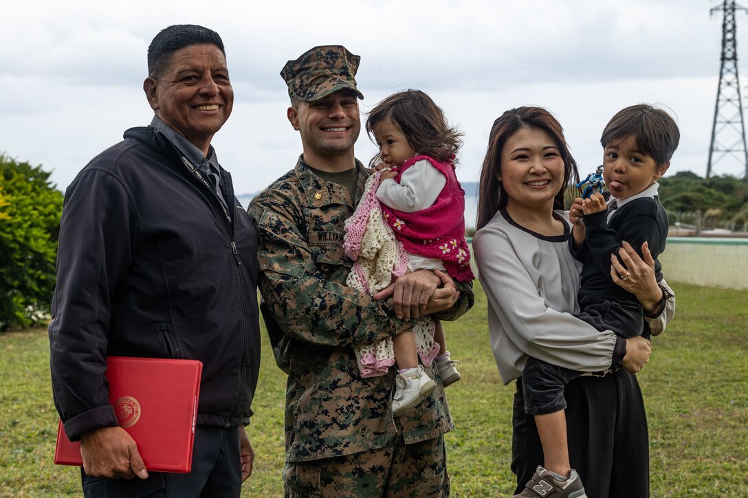 Gonzalo Antonio "Butch" Vasquez, 3d Marine Expeditionary Brigade Mission Assurance and Force Protection, U.S. Marine Corps Maj. Justin Williamson, force protection officer with 3d MEB, daughter Kaya Summer Williamson, wife Natsuko Williamson, and son Noah Tatsuki-Allen Williamson pose for a photo at Camp Courtney, Okinawa, Japan, January 6, 2024. A ceremony was held to promote Williamson from the rank of captain to major. 3D MEB maintains a forward presence in the Pacific Theater, responding to contingencies and strengthening alliances in support of the U.S. national security strategy. When crisis arises in the Indo-Pacific region, 3D MEB is fully prepared to execute our role as an Alert Contingency Marine Air Ground Task Force (MAGTF) or Humanitarian Assistance/ Disaster Relief (HA/DR) to provide aid and assist in alleviating hardship. (U.S. Marine Corps photo by 2nd Lt. Giovanni A. Jimenez)