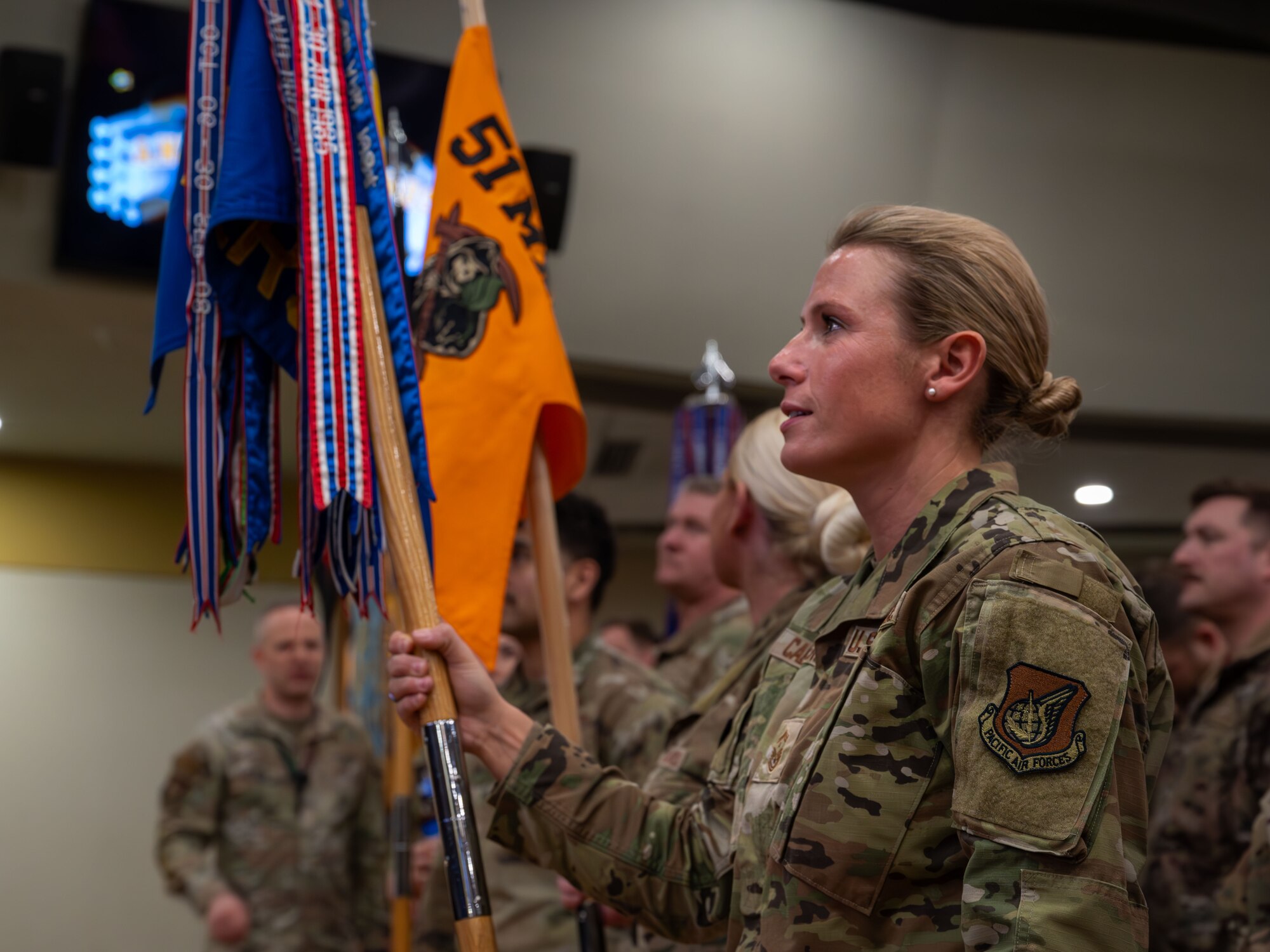 A U.S. Air Force Airman assigned to the 51st Fighter Wing cheers on annual award nominees at Osan Air Base, Republic of Korea, Feb. 21, 2025. The annual awards ceremony recognized 44 nominees and awarded 15 winners for their accomplishments and contributions to Osan AB and the ‘Fight Tonight’ mission. (U.S. Air Force photo by Senior Airman Sabrina Fuller-Judd)