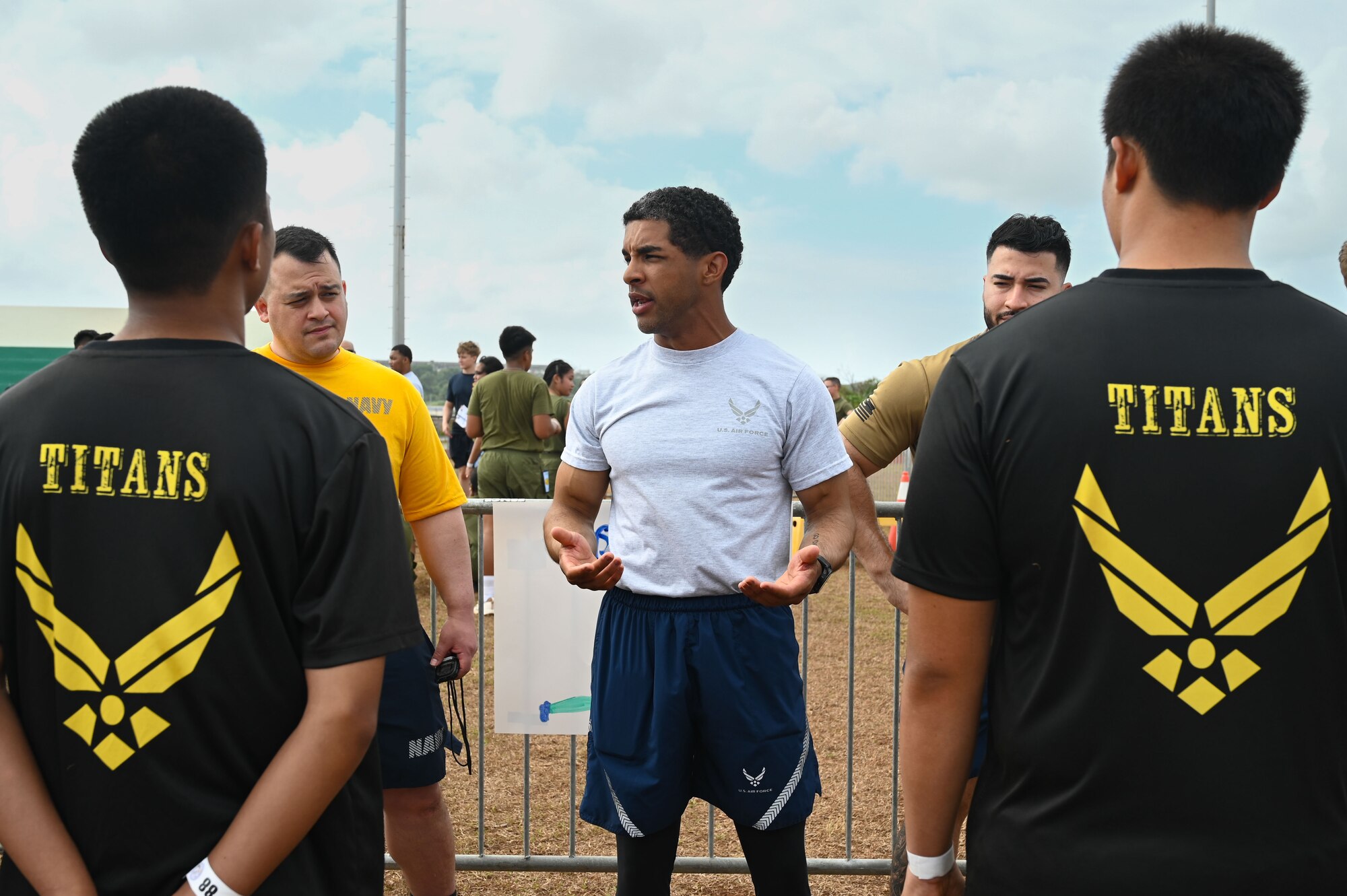 U.S. service members stationed in Guam and Guam Junior Reserve Officers’ Training Corps (JROTC) cadets pose for a picture after the annual JROTC Fitness Challenge at John F. Kennedy High School, Feb. 22, 2025. Five high schools participated in the event, and over 70 Air Force, Army, Navy, and Marine Corps service members volunteered to assist with boosting morale and fitness scores across the JROTC program.