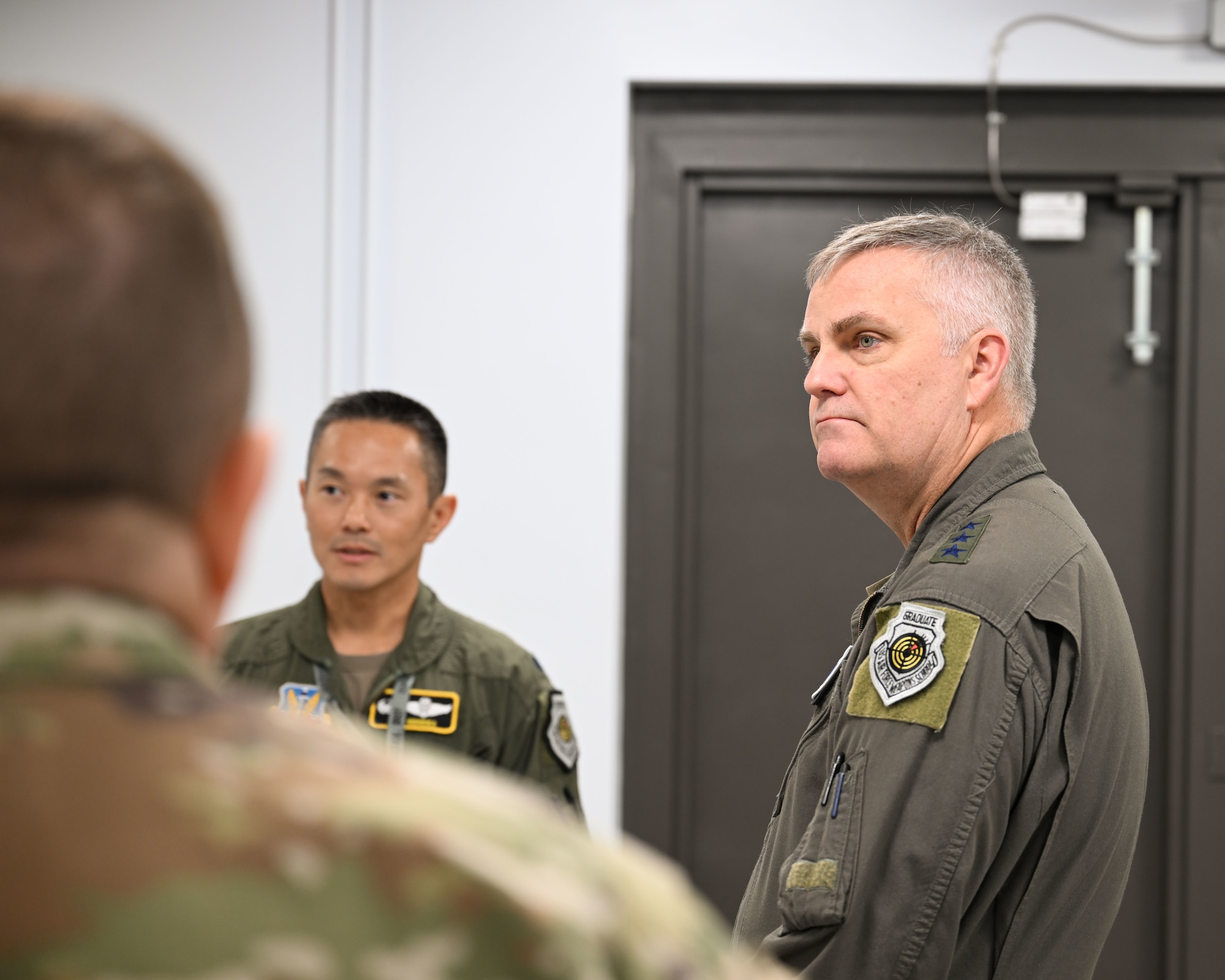 U.S. Air Force Lt. Col. Chad Nishizuka, 16th Electronic Warfare Squadron commander, give Lt. Gen. Michael Koscheski, Air Combat Command deputy commander, a tour of the facilities within the 16th EWS at Eglin Air Force Base, Florida, Jan. 30, 2025. The visit highlighted where the wing prioritizes key areas to meet the combatant commander Electromagnetic Spectrum Operations (EMSO) prime concerns. (U.S. Air Force photo by Senior Airman Anna Smith)