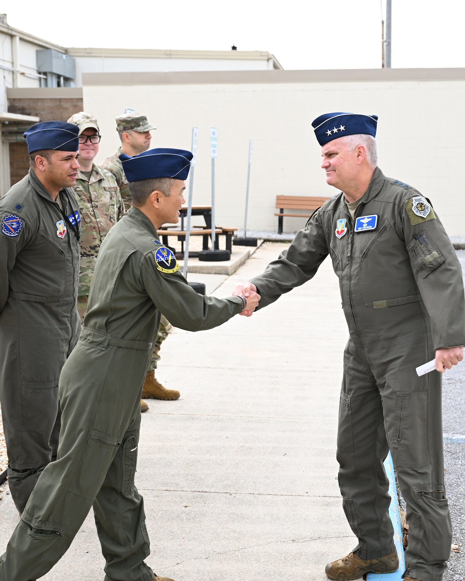 U.S. Air Force Lt. Col. Chad Nishizuka, 16th Electronic Warfare Squadron commander, greets Lt. Gen. Michael Koscheski, Air Combat Command deputy commander, during his visit to the 16th EWS headquarters at Eglin Air Force Base, Florida, Jan. 30, 2025. The visit allowed Koscheski, along with Brig. Gen. Jesse Friedel, U.S. Air Force Warfare Center deputy commander, to witness the wing’s work to increase warfighter lethality. (U.S. Air Force photo by Senior Airman Anna Smith)
