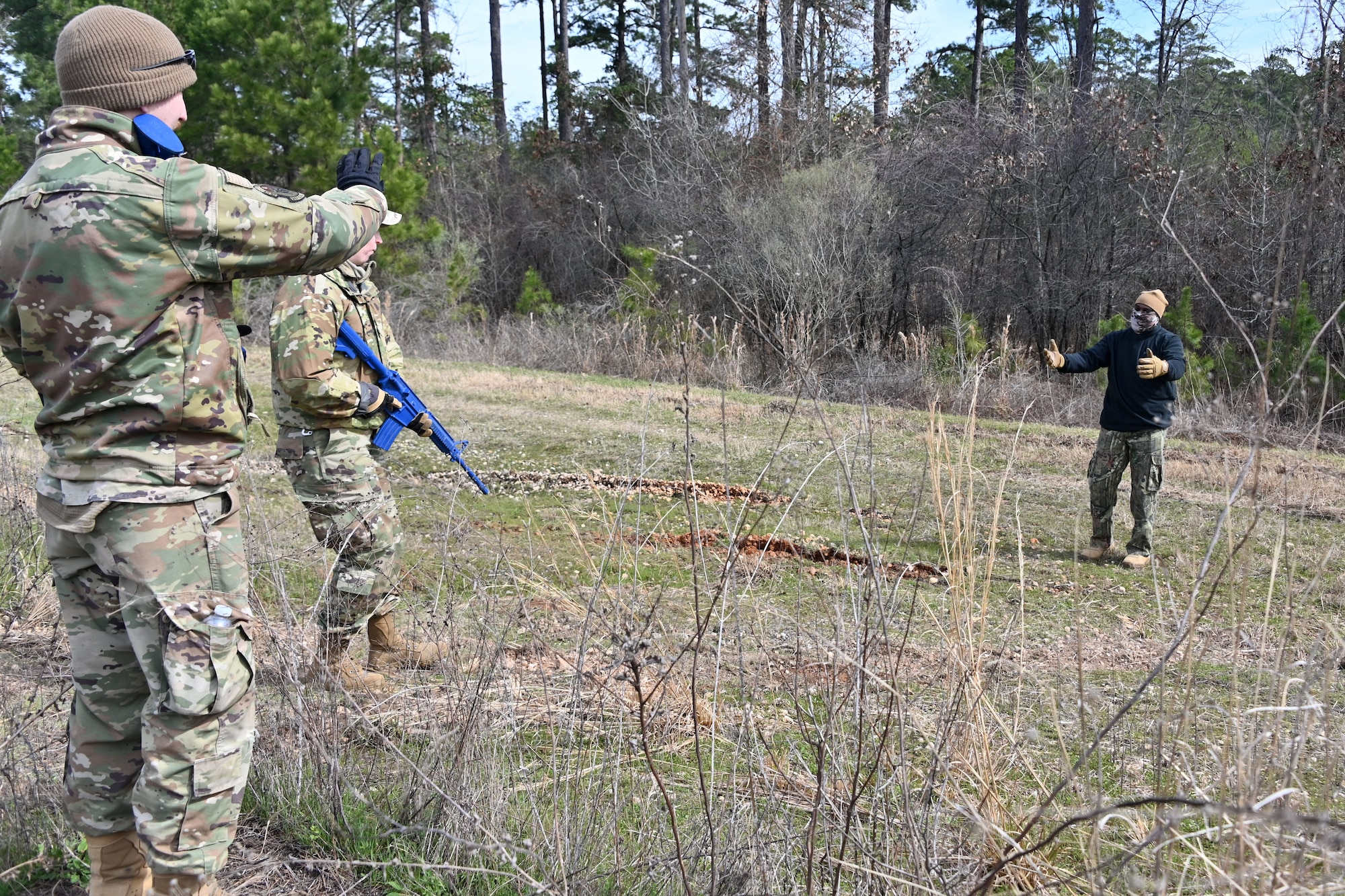 U.S. Airmen assigned to the 307th Civil Engineer Squadron encounter an opposition force member during a contingency training exercise February 21, 2025 at Barksdale Air Force Base, Louisiana.