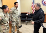 JOINT BASE SAN ANTONIO-FORT SAM HOUSTON - (Feb. 25, 2025) – Rear Adm. Matthew Case, director, U.S. Navy Medical Service Corps, presented director coins to Army Sergeants Carlos Torres and Samantha Salas assigned to Naval Medical Research Unit (NAMRU) San Antonio’s Research Services Directorate during a tour of unit facilities at the Tri-Service Research Laboratory. Case, who additional serves as the director of the Navy Medical Service Corps, visited NAMRU San Antonio to better understand the unit’s mission, capabilities, and impact to Navy Medicine. Torres was Navy Medical Research and Development’s (NMR&D) 2024 Solider of the year and Salas was Solider of the Quarter (3rd Quarter 2024). NAMRU San Antonio is one of eight research laboratories within Navy Medicine Research and Development. Its mission is to conduct gap driven combat casualty care, craniofacial, and directed energy research to improve survival, operational readiness, and safety of Department of Defense personnel engaged in routine and expeditionary operations. (U.S. Navy photo by Cmdr. Nicholas Hamlin, NAMRU San Antonio/Released)