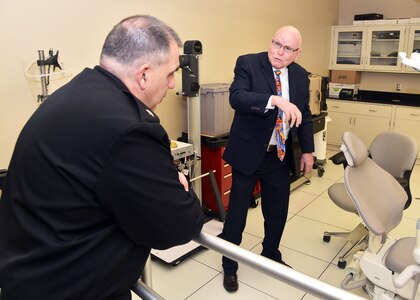 JOINT BASE SAN ANTONIO-FORT SAM HOUSTON - (Feb. 25, 2025) – Dr. John Simecek, director, Craniofacial Health and Restorative Medicine, Naval Medical Research Unit (NAMRU) San Antonio, briefs research on an in-house design of an amalgam separator for dental chairs to Rear Adm. Matthew Case, director, U.S. Navy Medical Service Corps at the Battlefield Health and Trauma Research Institute. Case, who additional serves as the director of the Navy Medical Service Corps, visited NAMRU San Antonio to better understand the unit’s mission, capabilities, and impact to Navy Medicine. NAMRU San Antonio is one of eight research laboratories within Navy Medicine Research and Development. Its mission is to conduct gap driven combat casualty care, craniofacial, and directed energy research to improve survival, operational readiness, and safety of Department of Defense personnel engaged in routine and expeditionary operations. (U.S. Navy photo by Burrell Parmer, NAMRU San Antonio Public Affairs/Released)