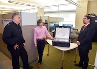 JOINT BASE SAN ANTONIO-FORT SAM HOUSTON - (Feb. 25, 2025) – Andres Martinez Murillo, a biomedical engineer assigned to Combat Casualty Care and Operational Medicine, Naval Medical Research Unit (NAMRU) San Antonio, joined by research scientist Tarea Burton, briefs the capabilities of a portable ozone sterilizer to Rear Adm. Matthew Case, the Defense Health Agency’s (DHA) acting assistant director, Health Administration (AD-HCA) at the Battlefield Health and Trauma Research Institute. The purpose of Case’s visit was to better understand NAMRU San Antonio 's mission, capabilities, and impact to Navy Medicine. NAMRU San Antonio is one of eight research laboratories within Navy Medicine Research and Development. Its mission is to conduct gap driven combat casualty care, craniofacial, and directed energy research to improve survival, operational readiness, and safety of Department of Defense personnel engaged in routine and expeditionary operations. (U.S. Navy photo by Burrell Parmer, NAMRU San Antonio Public Affairs/Released)