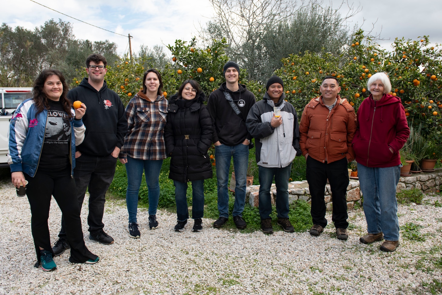 Personnel assigned to Naval Support Activity Souda Bay; American Forces Network Souda Bay; and Naval Supply Systems Command Fleet Logistics Center Sigonella, Site Souda Bay, pick oranges during a volunteer community service project on Feb. 10, 2025.