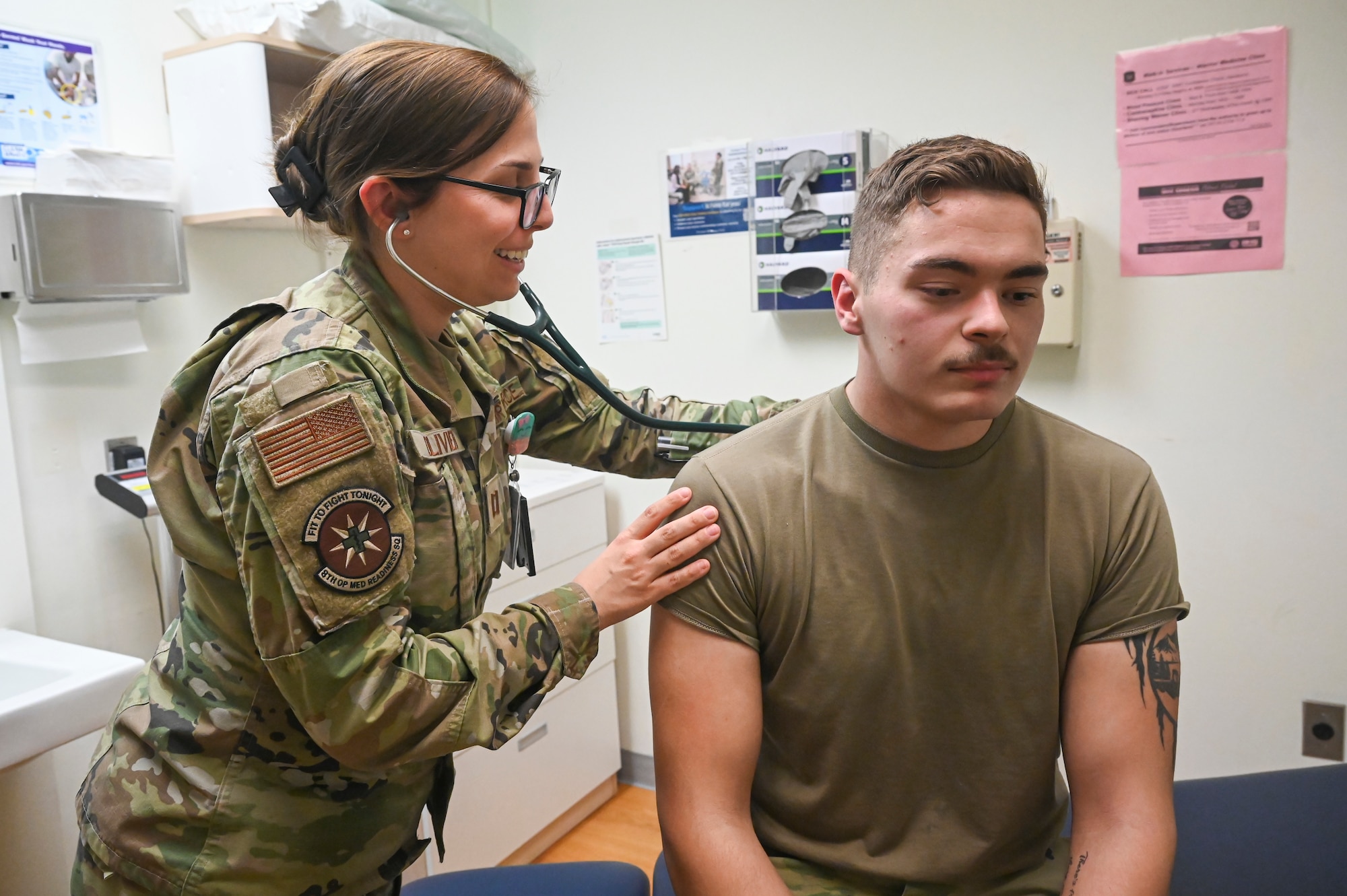U.S. Air Force Capt. Lauren Olivieri, 8th Operational Medical Readiness Squadron warrior medicine physician, conducts a patient check-up on Senior Airman David Adsit, 8th Logistics Readiness Squadron vehicle maintenance technician.