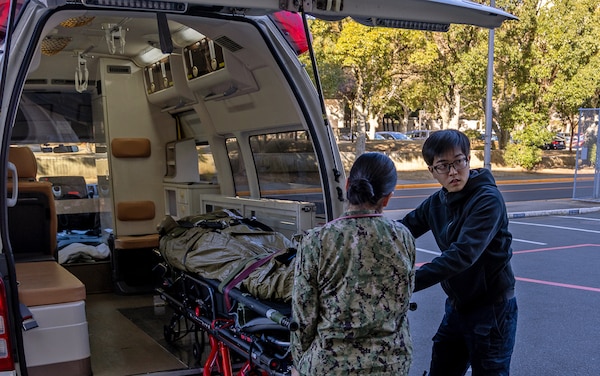 YOKOSUKA, Japan (Feb. 20, 2025) U.S. Naval Hospital (USNH) Yokosuka personnel transport a simulated patient to USNH Yokosuka during a mass casualty drill. USNH Yokosuka and 374th Medical Group from Yokota conducted a surgical team assist and medical evacuation (MEDEVAC) operation during the joint mass casualty drill. The drill tested the efficiency of transporting a surgeon from Yokosuka to Yokota via 459th Airlift Squadron while simultaneously evacuating a Yokota-based trauma patient to a higher level of care in Yokosuka. (U.S. Navy photo by Daniel Taylor/USNMRTC Yokosuka Public Affairs)