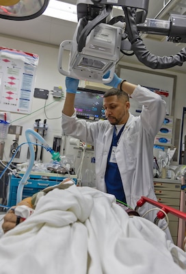 YOKOSUKA, Japan (Feb. 20, 2025) U.S. Naval Hospital (USNH) Yokosuka personnel conduct a Code Trauma Drill on a simulated patient during a mass casualty drill. USNH Yokosuka and 374th Medical Group from Yokota conducted a surgical team assist and medical evacuation (MEDEVAC) operation during the joint mass casualty drill. The drill tested the efficiency of transporting a surgeon from Yokosuka to Yokota via 459th Airlift Squadron while simultaneously evacuating a Yokota-based trauma patient to a higher level of care in Yokosuka. (U.S. Navy photo by Daniel Taylor/USNMRTC Yokosuka Public Affairs)