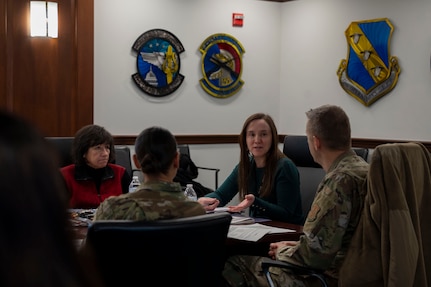 OSD and JBAB leadership sit at a conference table discussing project plans.