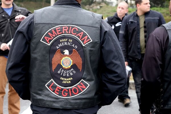250220-N-DO281-1004 OKINAWA, Japan (Feb. 20, 2025) – An American Legion member poses for a photo before a motorcycle safety ride through Okinawa, Japan, Feb. 20, 2025. (U.S. Navy photo by Mass Communication Specialist 1st Class Trey Fowler)