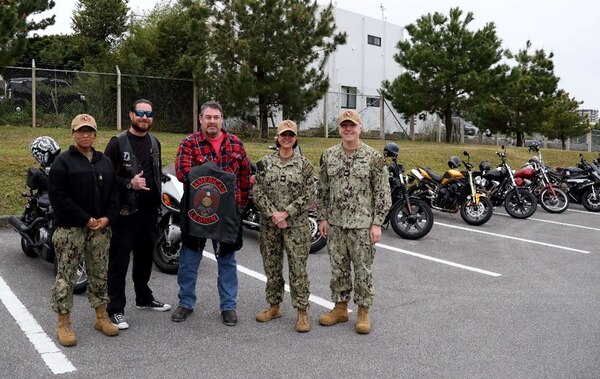 250220-N-DO281-1033 OKINAWA, Japan (Feb. 20, 2025) – Navy Medicine Readiness and Training Command Okinawa leaders and members of the American Legion Riders pose for a photo before a motorcycle safety ride through Okinawa, Japan, Feb. 20, 2025. (U.S. Navy photo by Mass Communication Specialist 1st Class Trey Fowler)