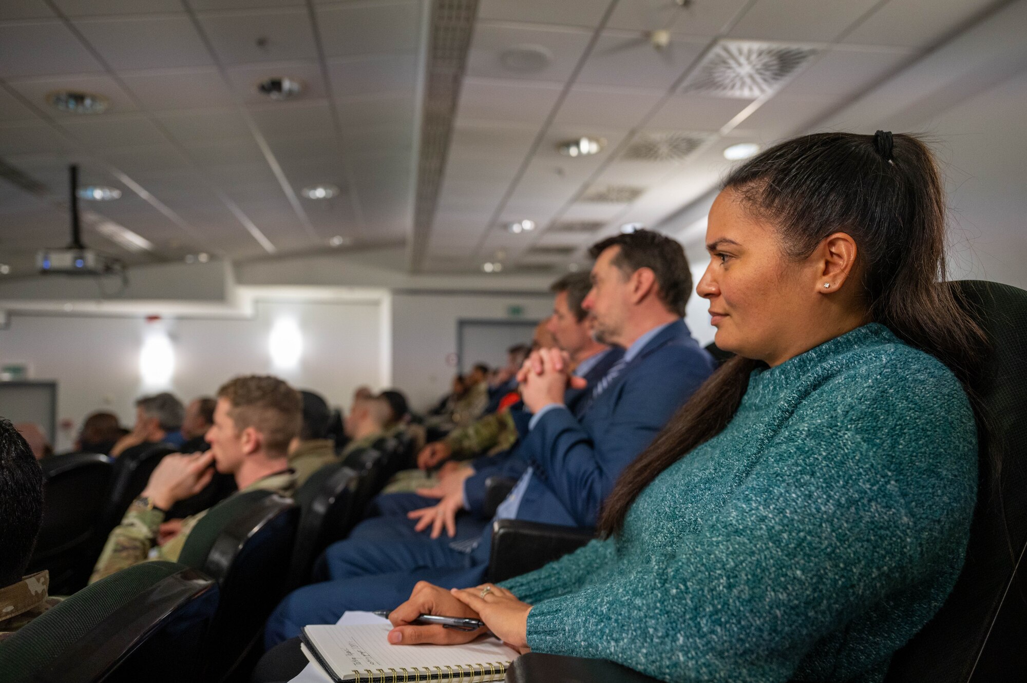 U.S. Airmen and civilian personnel listen to briefs provided by  U.S. Air Forces in Europe - Air Forces Africa financial management leadership during the USAFE-AFAFRICA 2025 Budget Symposium on Ramstein Air Base, Germany, Feb. 25, 2025. The symposium focused on concepts such as resourcing priorities, operational focus areas, and maximizing buying power, to resource advisors and financial management leaders within USAFE-AFAFRICA.
