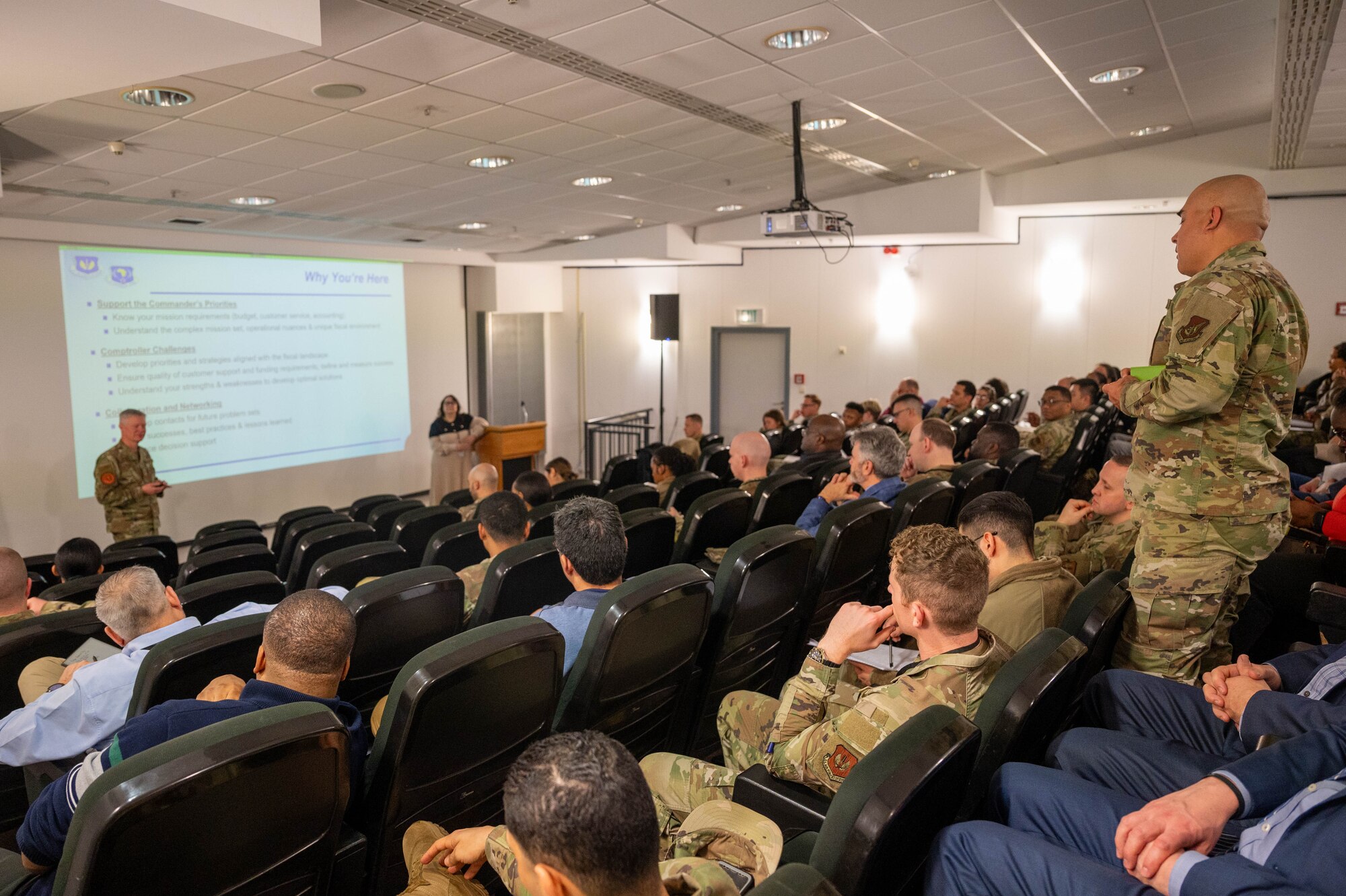 A member of the audience asks a question during the U.S. Air Forces in Europe - Air Forces Africa 2025 Budget Symposium on Ramstein Air Base, Germany, Feb. 25, 2025. The main goal for this event was to bring together all the financial managers within USAFE-AFAFRICA and maximize funding strategies for all missions.